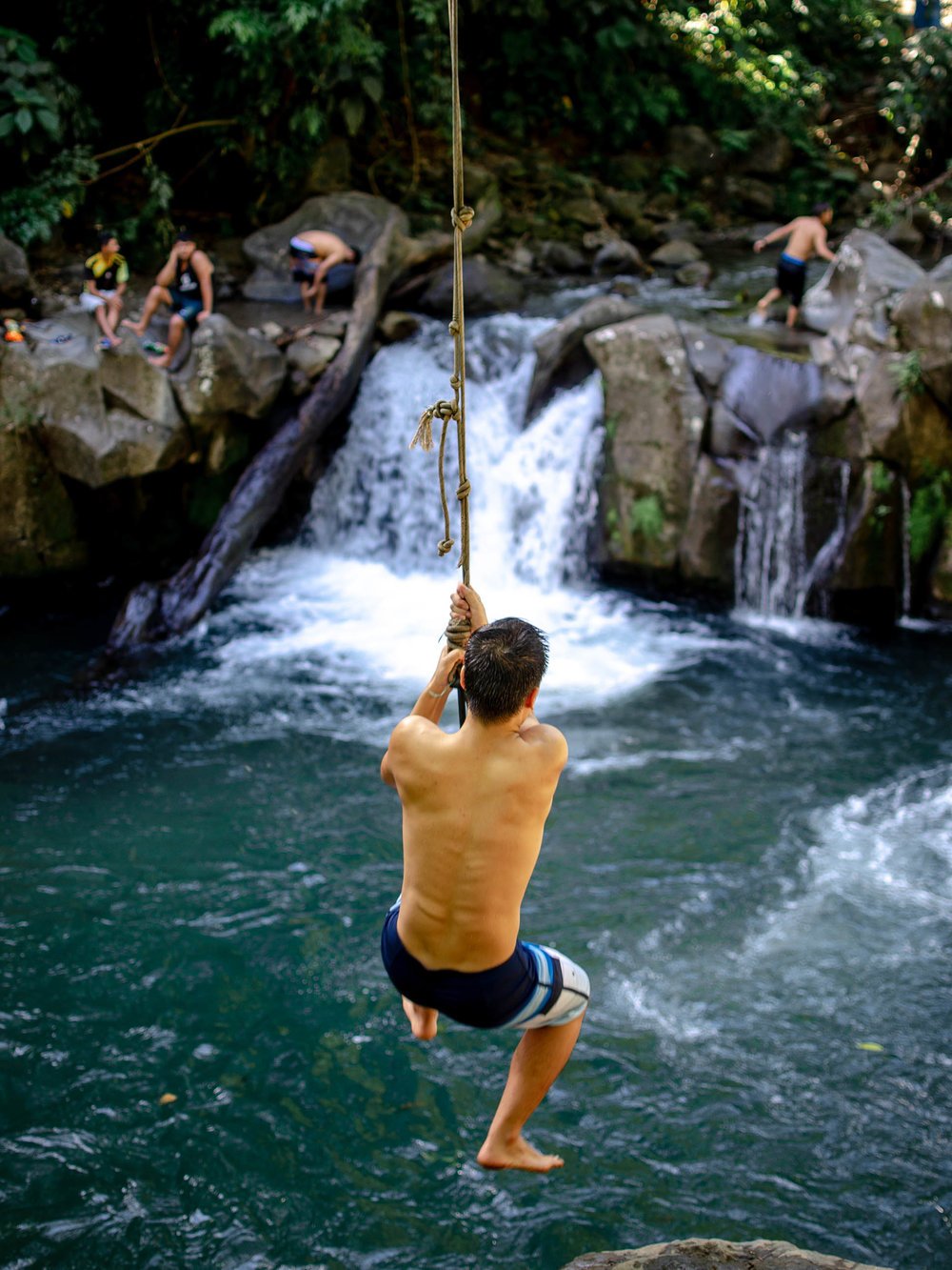 rope swing into waterfall - la fortuna