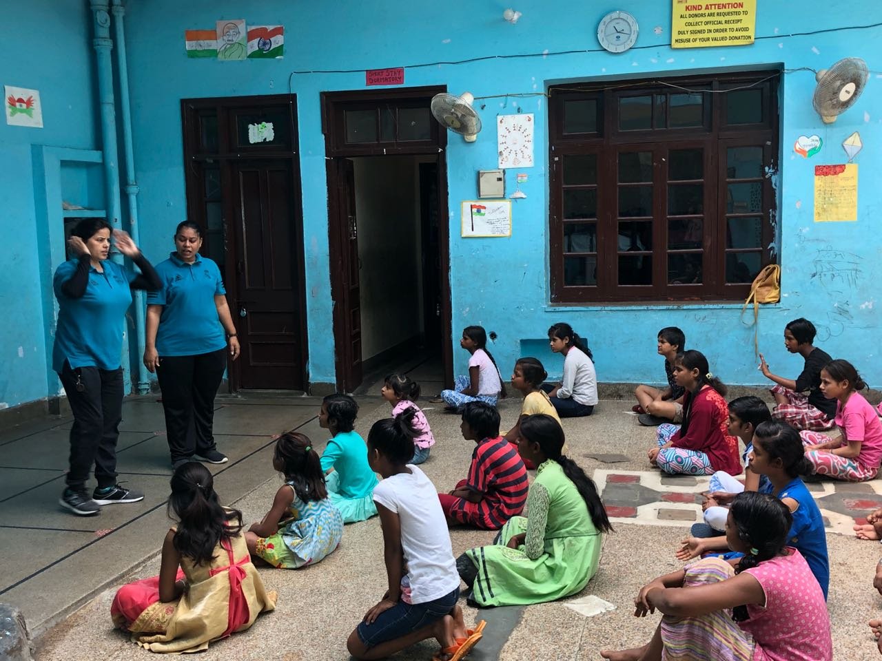 Children being taught at a charity centre in India