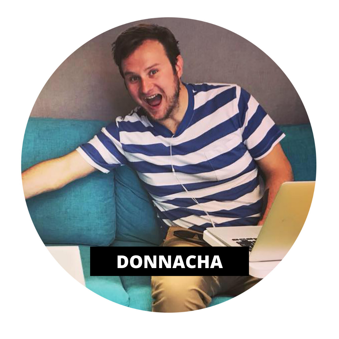 TruCrew Donnacha sitting on blue sofa with laptop on desk