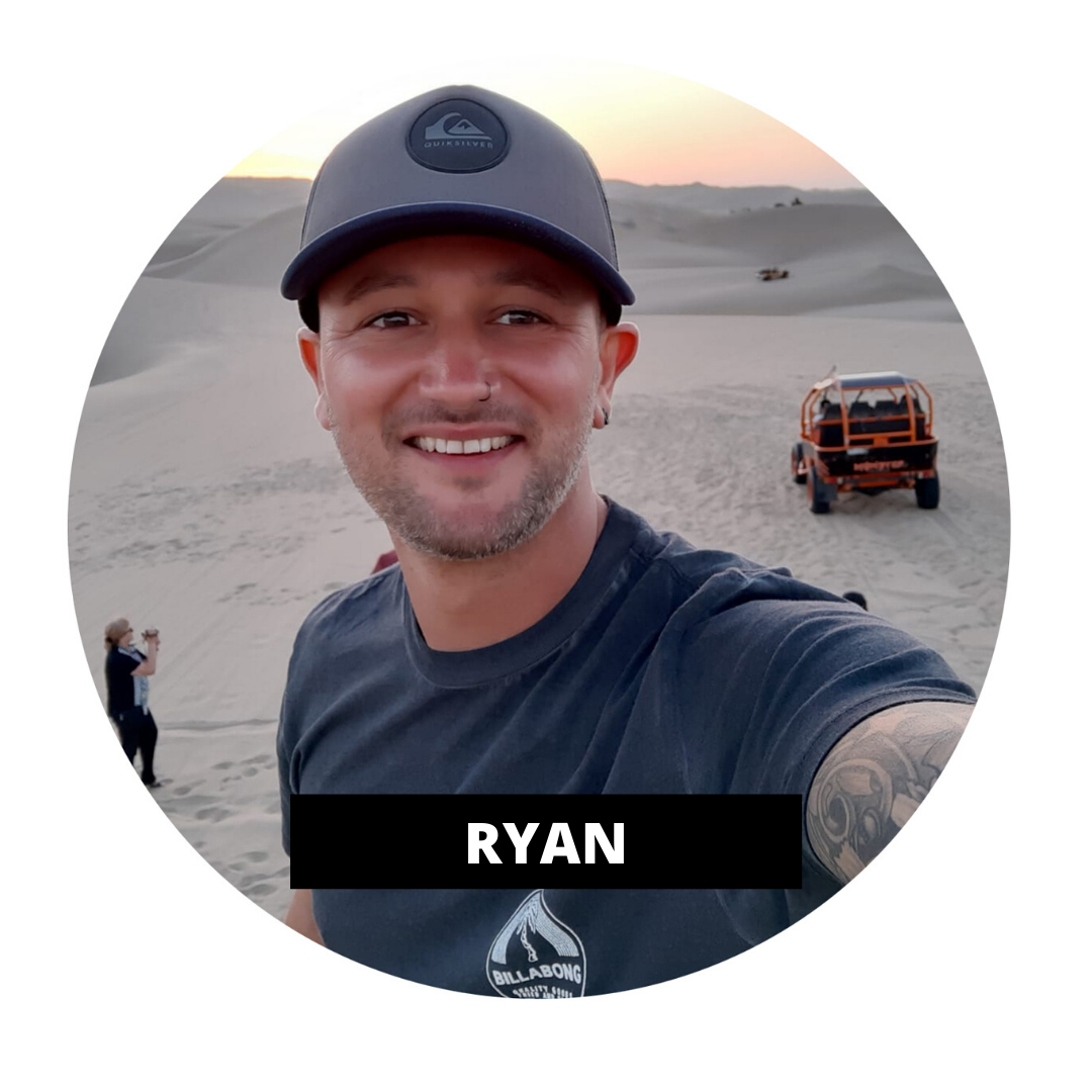 TruCrew Ryan in desert smiling at camera with hat on