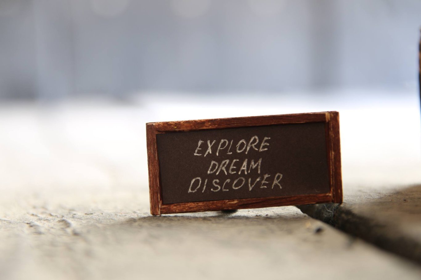 A quote that reads ''Explore, Dream, Discover''