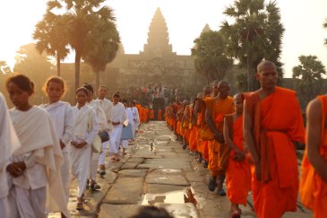 A photo of the monks at Angkor Wat in Siem Reap, Cambodia at sunrise 