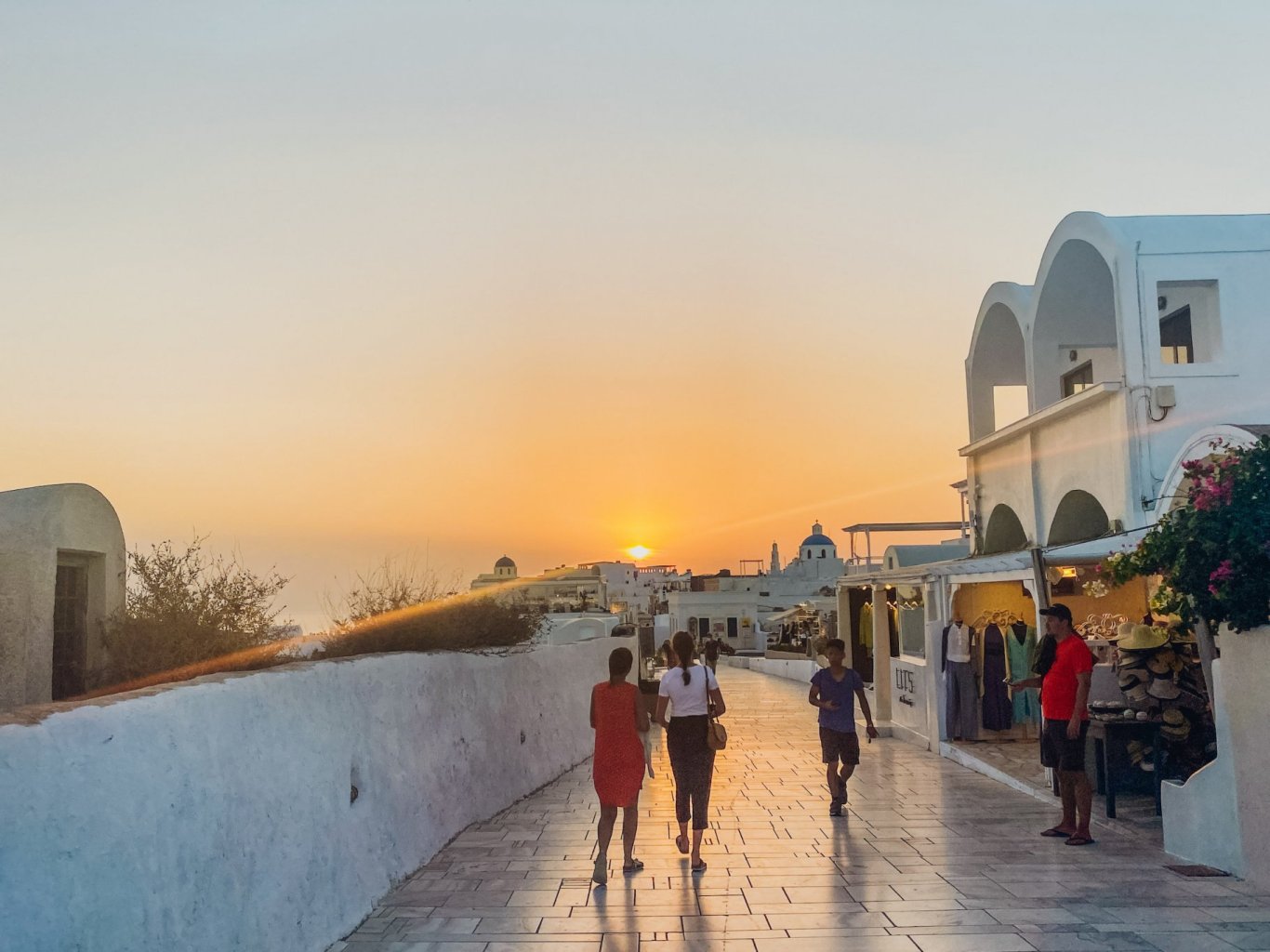 The beautiful orange sunset that Oia is known for in Santorini, Greece.