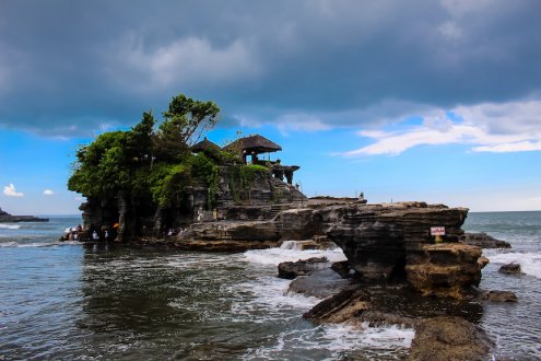 View of Tanah lot temple in Bali, surrounded by the sea