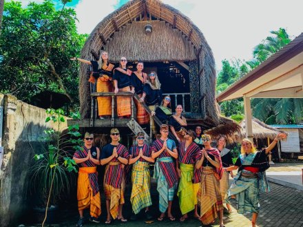 A group wearing traditional clothing at the Sasak village in Lombok, Indonesia 