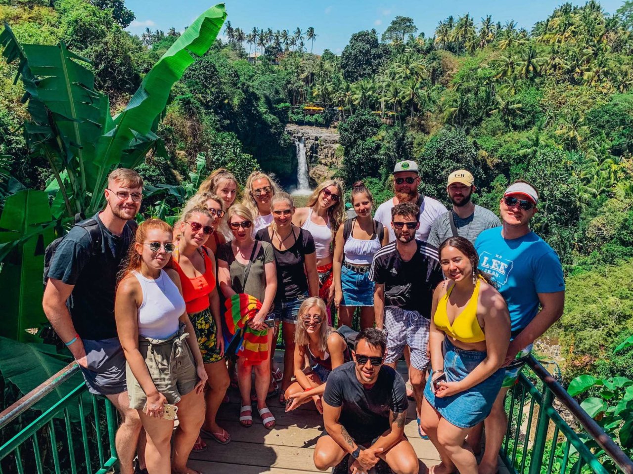 A group shot by Tegenungan waterfall in Indonesia