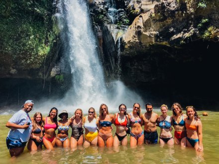 A group shot at the Tegenungan waterfall in Bali Indonesia 