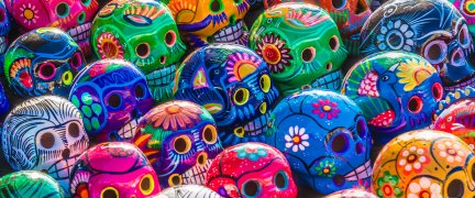 An image of day of the dead skulls in many different colours 