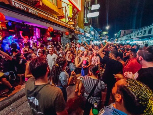 A lively photo of a crowd enjoying the nightlife in Bangkok