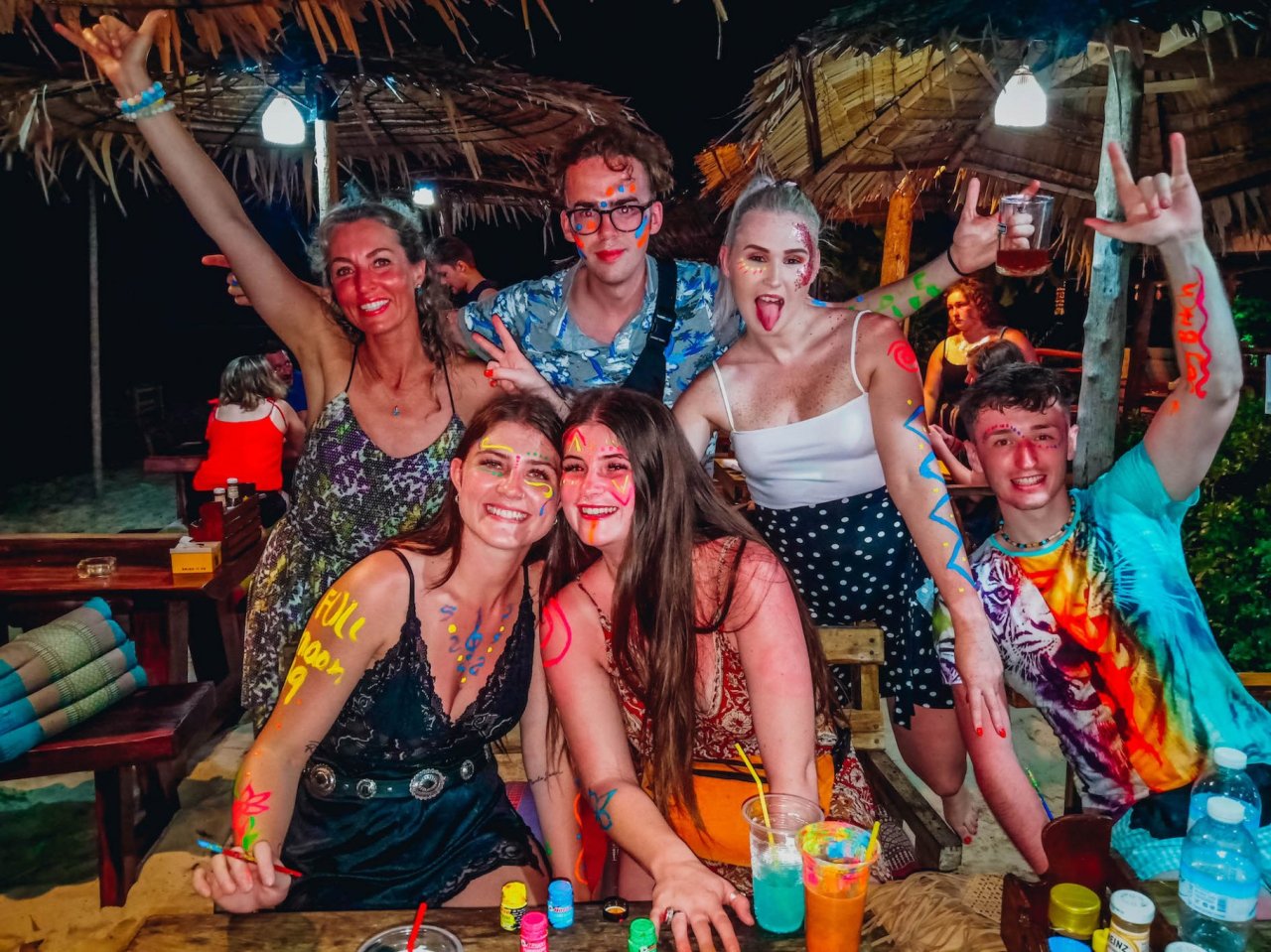 A group getting ready with paint at the full moon party in Koh Phangan Thailand 