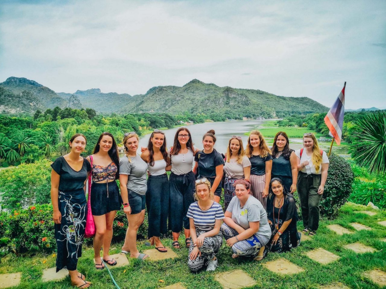 A group by the stunning view of the river in Kanchanaburi Thailand 