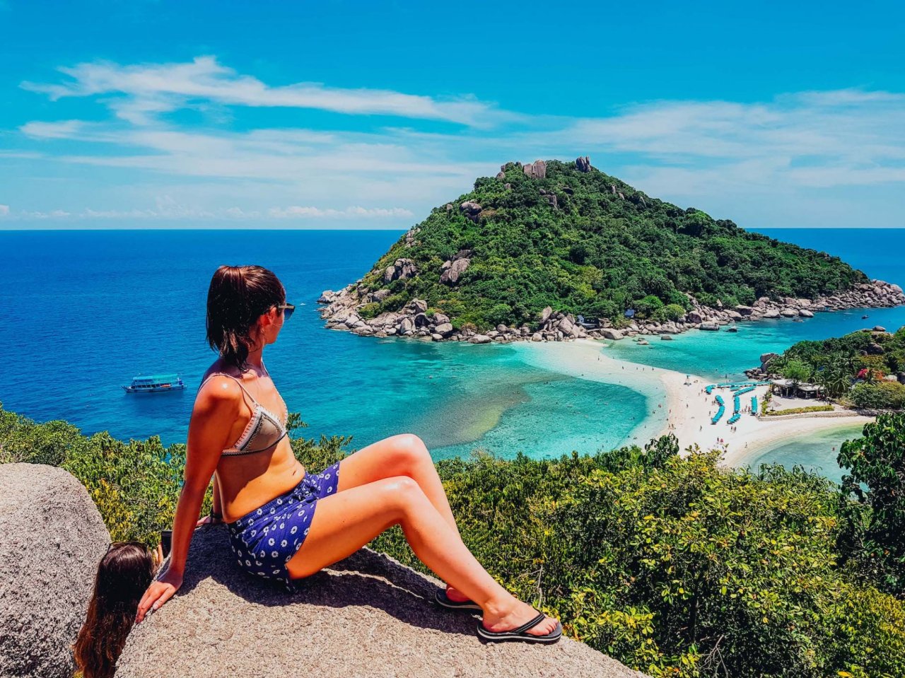 A girl at the top of the viewing platform overlooking Nang Yuan Island in Koh Tao Thailand