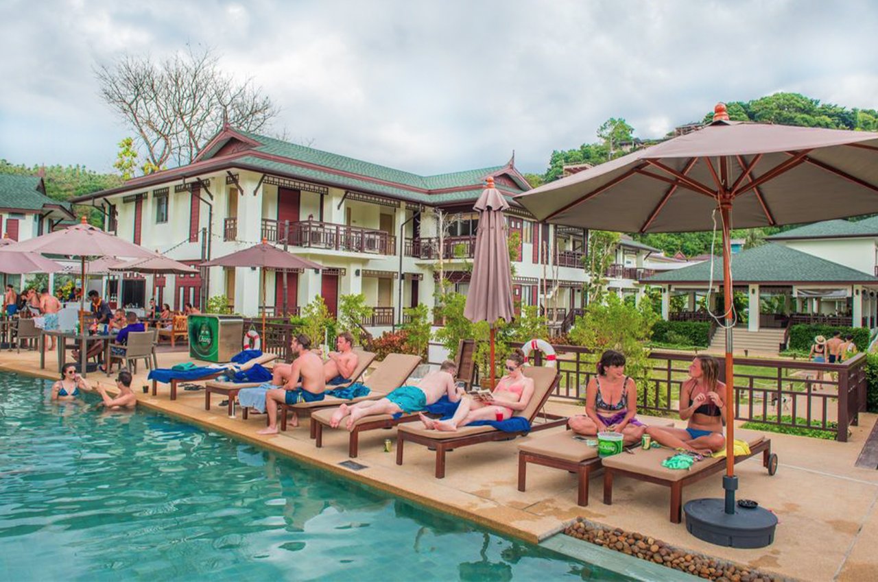 A shot of people lounging by the turquoise pool at the hotel in Koh Phi Phi, Thailand 