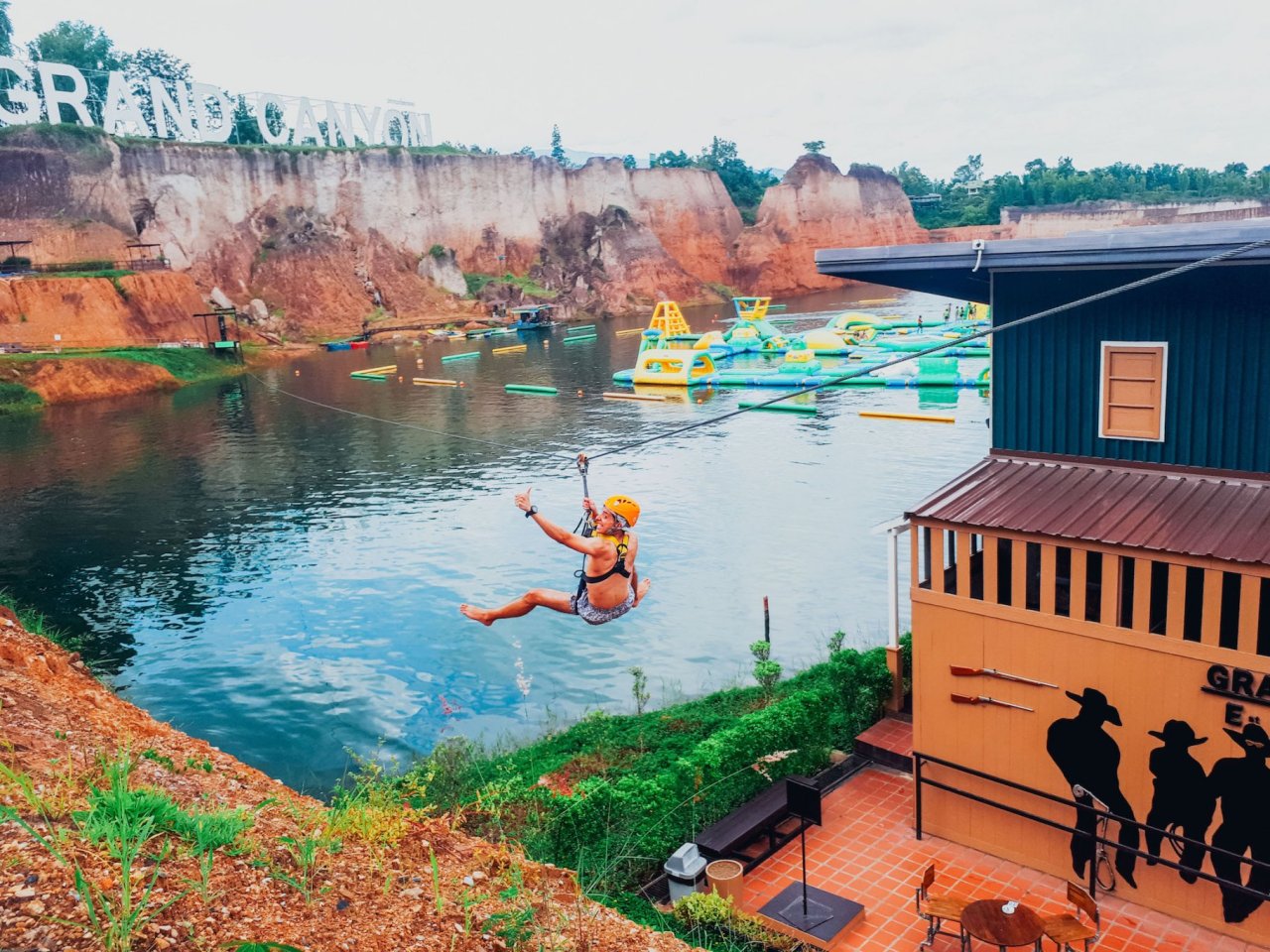 Girl trying the zip line at the Grand Canyon Chiang Mai Thailand 