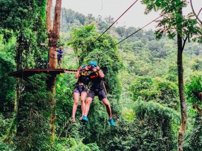 A couple having a moment on the zip line in Chiang Mai Thailand 