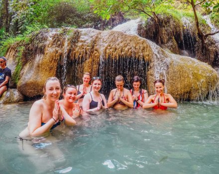 A group photo at Erawan falls in Thailand 
