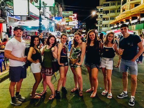 A group enjoying the night life on Khao San road in Bangkok Thailand 