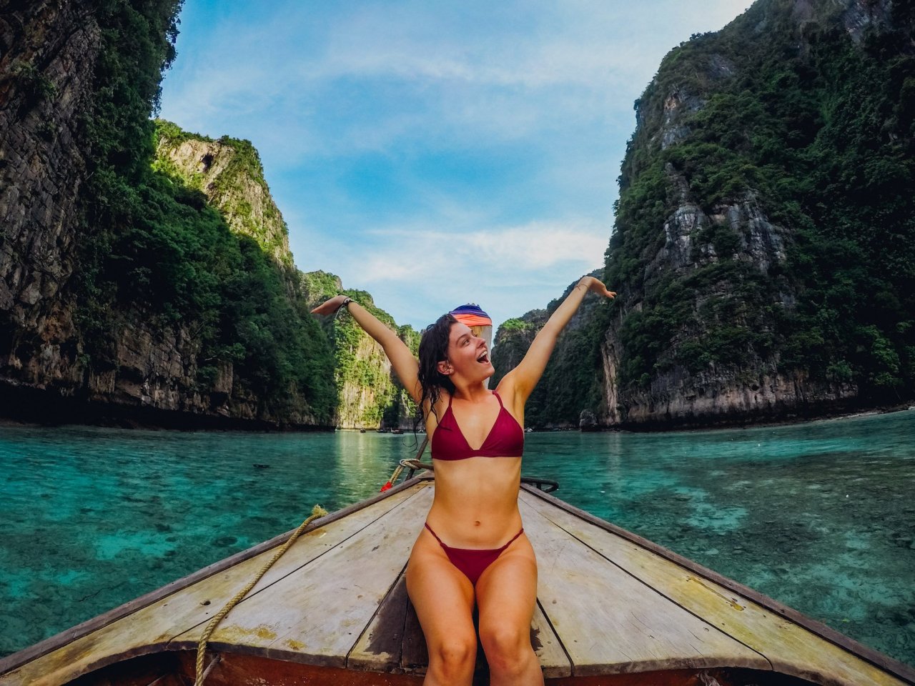 A girl on a boat at Maya bay in Koh Phi Phi Thailand 
