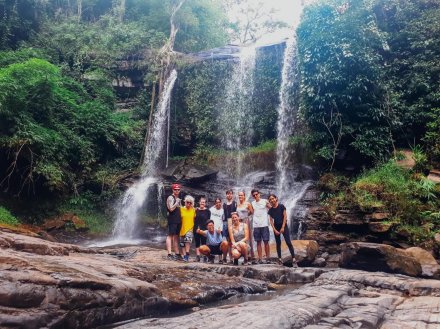 Group photo at the waterfall while Jungle trekking in Northern Thailand