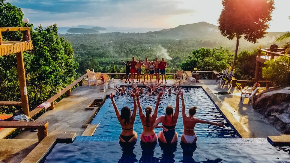 A group photo at the pool in Koh Phangan overlooking the incredible view