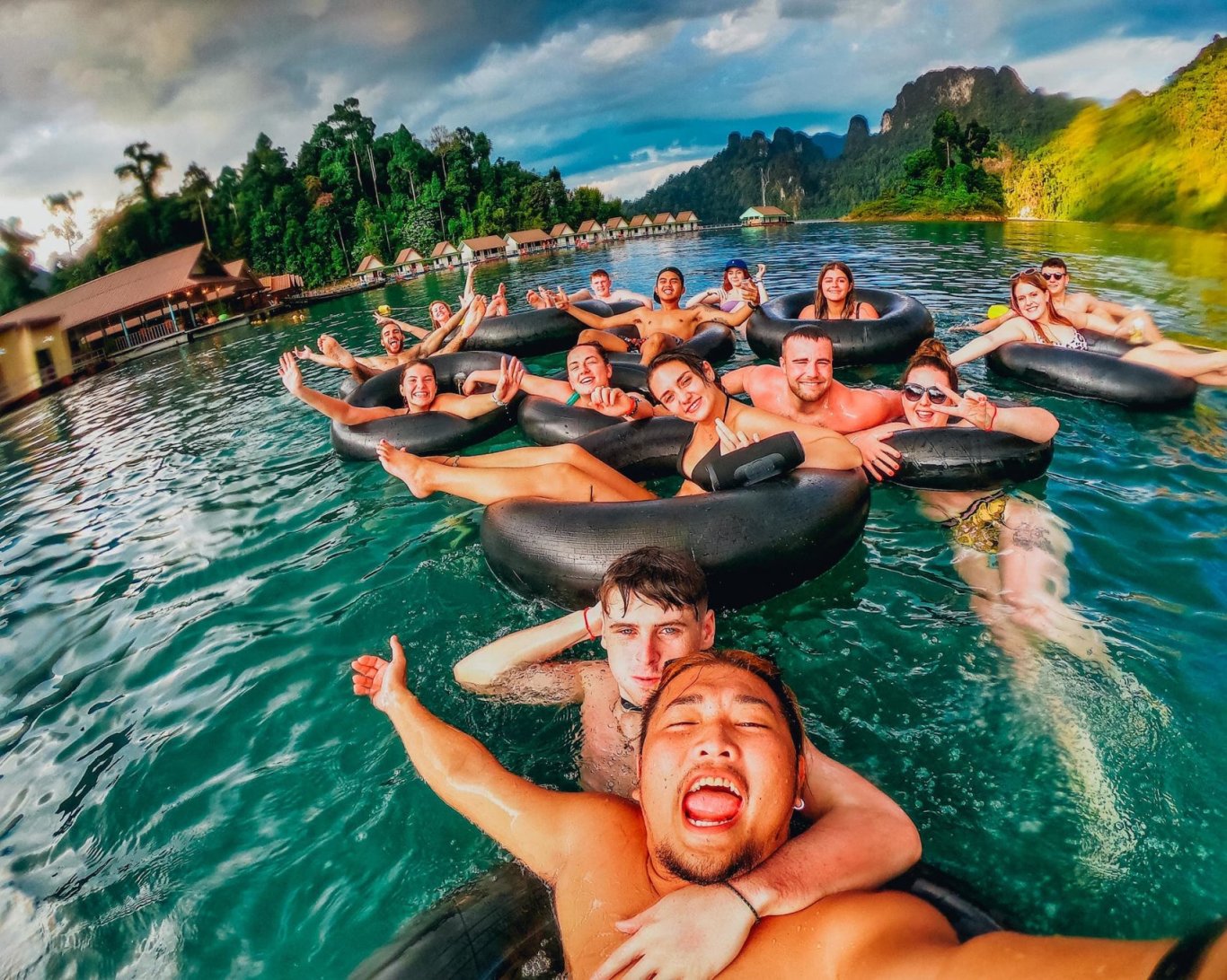 A group shot in donuts on the lake in Khao Sok National Park Thailand