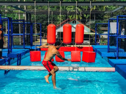 Going through the water obstacle course in Koh Phangan Thailand