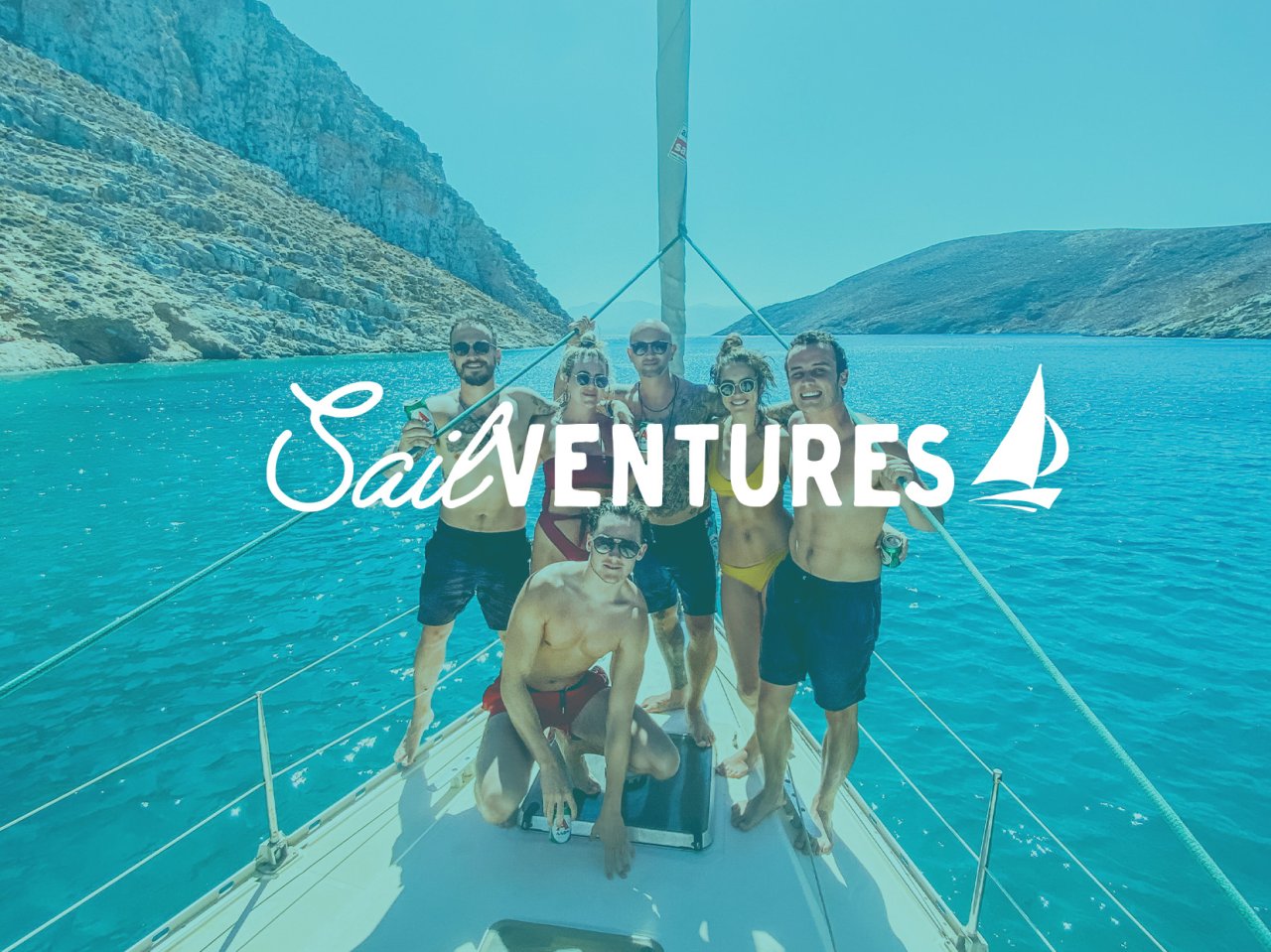 SailVentures text with a background of a group on a sailboat in Greece with the bright blue ocean